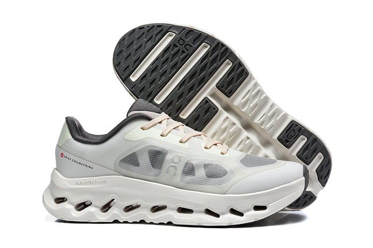 White and gray On Cloudtilt Remix sneakers shown with the outsole visible.
