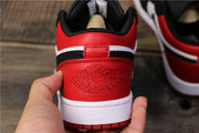 Rear view of the red heel panel with an embossed winged basketball design.