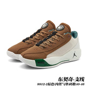 Pair of brown and cream Jordan 8812 basketball shoes with green accents and contrasting laces.