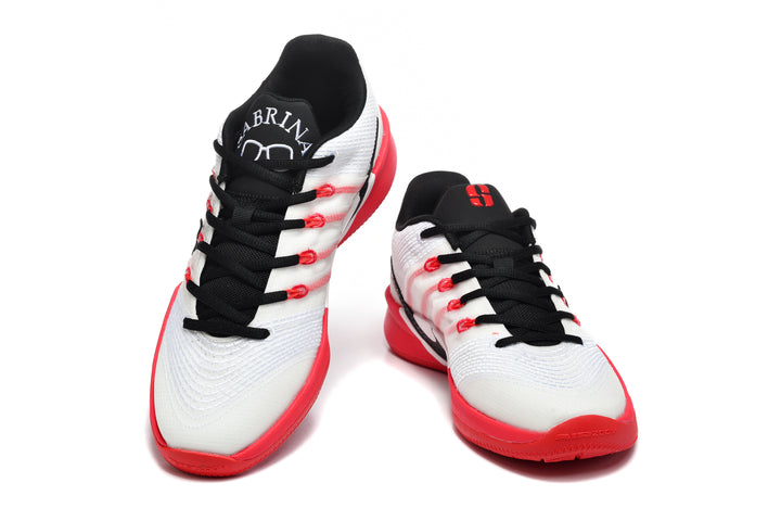 Pair of white, red, and black low-top basketball shoes shown from the front.