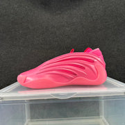 Side profile of a vivid pink sneaker with layered panels and elongated ventilation openings.
