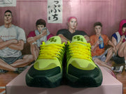Front view of green and yellow lace-up basketball sneakers