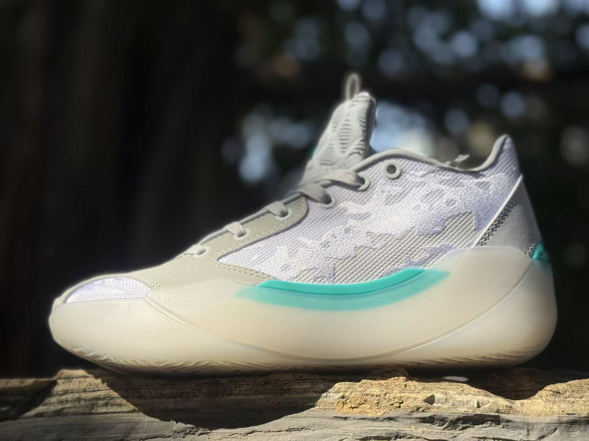 Side view of gray and lavender Jordan 39 sneakers with teal midsole accents.