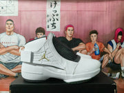 Side profile of a white and gray high-top sneaker with a wide strap, black textured-look panel, and contrasting outsole.