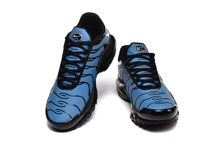 Blue-and-black Nike Air Max Plus sneakers shown from the front