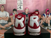 Rear view of red and white Nike Air More Uptempo sneakers