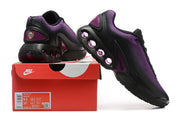 Black and purple Nike Air Max DN sneakers displayed with a box labeled Air Max DN; the box label shows EU 42.5, US Men 8.5 and US Women 10
