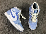 Top view of the sneaker pair showing the blue toe panels, white overlays, laces, and high-top shape.