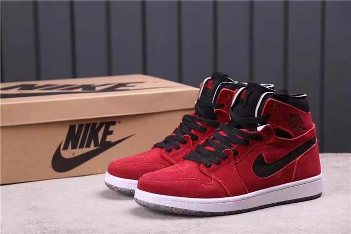 Pair of red and black high-top sneakers shown with a Jordan-branded shoe box.