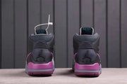 Rear view showing the padded ankle collars, purple heel sections, and grey midsoles.