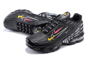 Pair of black Nike Air Max Plus sneakers shown from above and at an angled side view.
