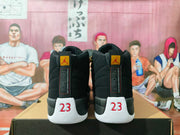 Rear view of black high-top sneakers showing Jordan heel labels and the number 23 in red and white.