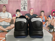 Rear view of the Jordan sneakers showing black heel panels, white collar sections, and translucent blue-tinted outsoles.