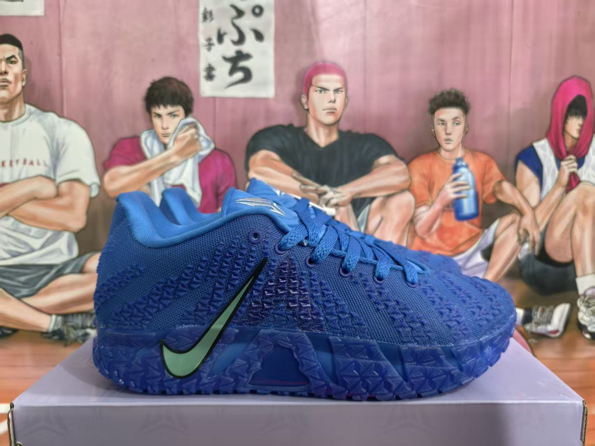 Blue Nike basketball sneaker shown from the side with a textured upper and contrasting Swoosh.