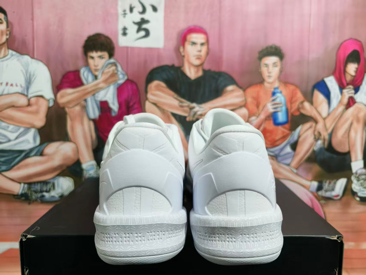 Rear view of a pair of white Nike Kobe basketball shoes