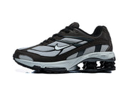 Side view of a brown and silver Nike Shox Ride 2 sneaker with mesh panels and visible heel columns.
