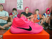 Side profile of a pink basketball sneaker with a black Swoosh and layered wave-like upper and midsole detailing.