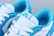 Close-up of the padded tongue, white laces, and blue Nike SB tongue labels.