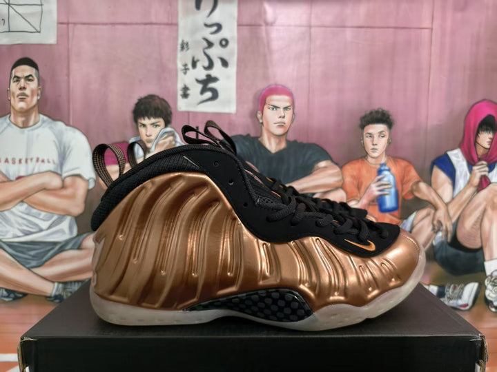 Side view of bronze and black high-top sneakers with a sculpted molded upper and translucent outsole.