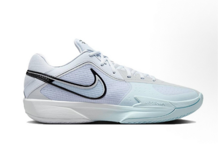 Side view of light beige and pale blue Nike low-top sneakers with a black Swoosh and sculpted outsole.