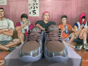 Front view of the blue-gray sneakers showing brown laces, patterned toes, and Nike tongue branding.