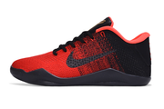 Side profile of a red and black lace-up basketball shoe