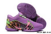 Purple and green Nike LeBron 22 sneakers with a multicolor patterned side panel.