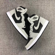 Pair of black and grey high-top sneakers shown from an overhead angle.