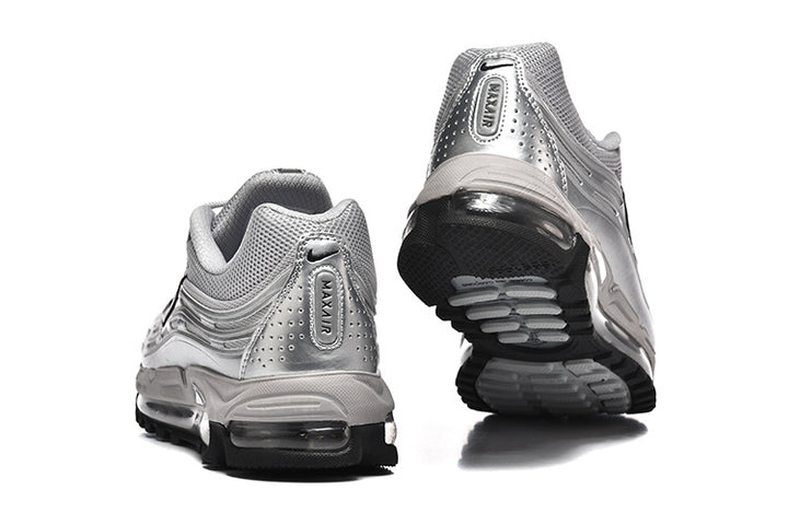 Nike Air Max 97 sneakers shown from the heel and outsole in silver and black