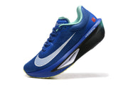 Angled side view of a blue Nike Zoom Fly 6 shoe with teal lining and a black-and-white sole.