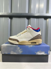 Single side profile showing the white upper, brown elephant-print heel panel, blue collar lining, and cream midsole.