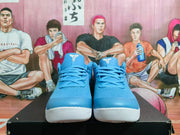 Front view of blue basketball shoes with white outsole accents