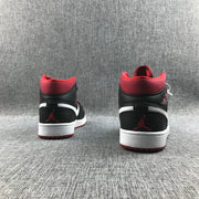Rear view of the pair showing red collars, black heel panels, white accents, and red Jumpman details.