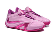 Angled view of the pair of pink and magenta basketball shoes