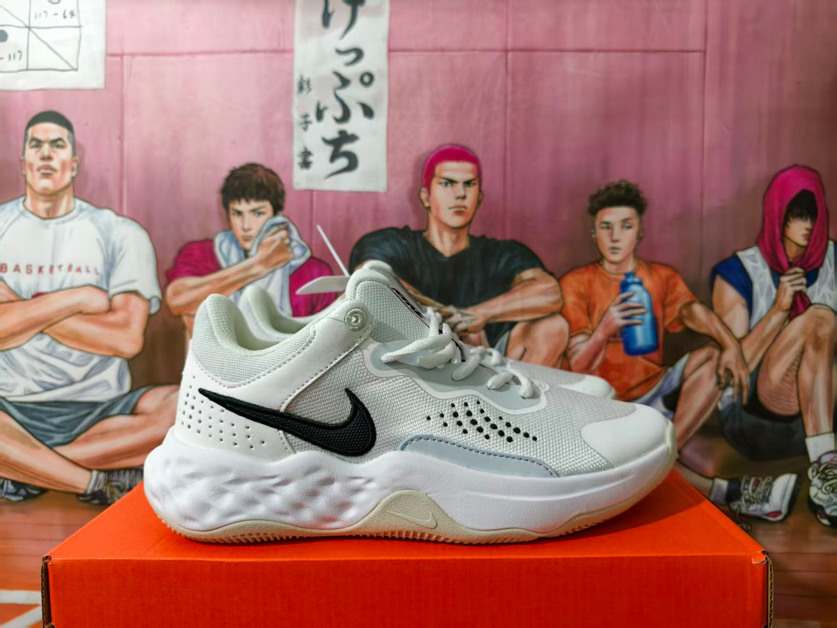 Side view of a gray and white Nike sneaker with a black Swoosh on an orange shoebox.