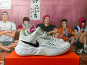 Side view of a gray and white Nike sneaker with a black Swoosh on an orange shoebox.