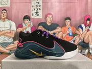 Side view of a black Nike basketball shoe with a dark teal panel, pink-red trim, and gold-colored logo