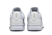 Rear view of the white shoes showing padded collars and heel panels