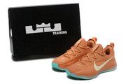 Warm orange LeBron TR1 shoes beside a black Training box