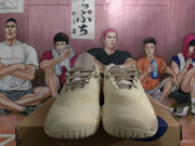 Front view of the shoes showing mesh panels, laces, and textured toe areas