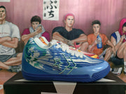 Side view of the blue Converse basketball shoe with patterned panels and a star-and-chevron design.