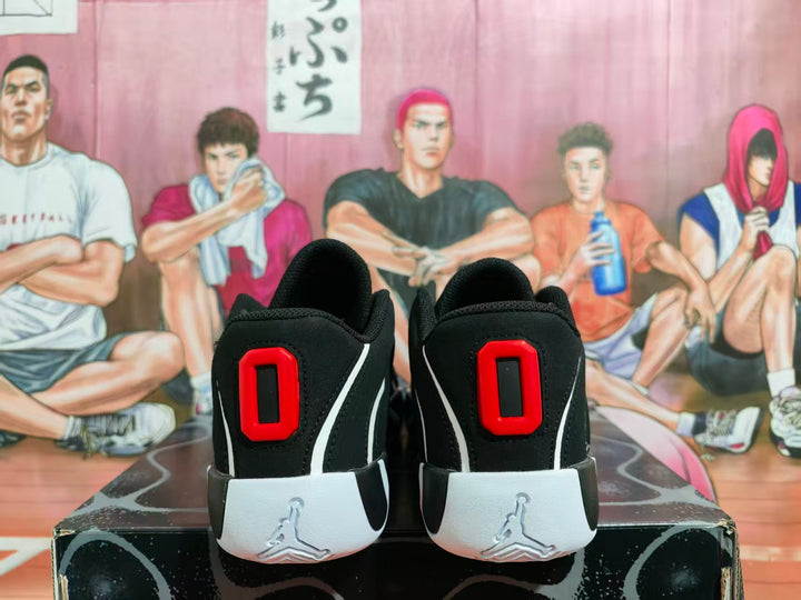 Rear view of black Jordan basketball shoes with red heel accents and white midsoles