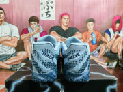 Rear view of the cobalt blue sneakers showing patterned heels, padded collars and visible branding.