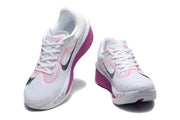 White Nike Zoom Fly 6 shoes with black and pink accents, viewed from the front