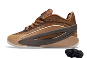 Brown sneaker shown in side profile with a dark contrasting side panel and patterned upper.
