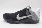 Side view of a black, grey, and white Nike Kobe 11 shoe