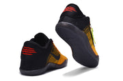 Orange and black basketball shoes showing heel and outsole details