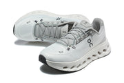 Pair of light gray On lace-up running shoes shown from above and at an angle.