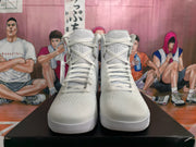 Front view of white high-top basketball shoes with laces and textured-looking uppers