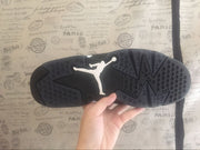 Close view of the black rubber outsole showing circular traction details and a contrasting Jordan logo.